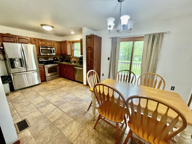 350 Brier Crest Rd, Blakeslee, PA 18610 - dining area with a chandelier and light stone finish flooring