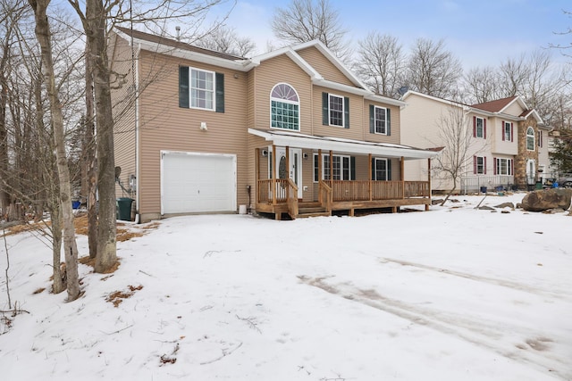 view of front of property with covered porch and a garage