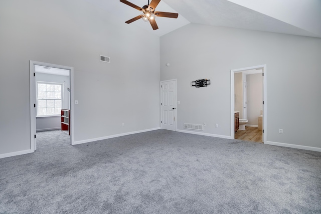 unfurnished living room featuring ceiling fan, visible vents, and carpet flooring