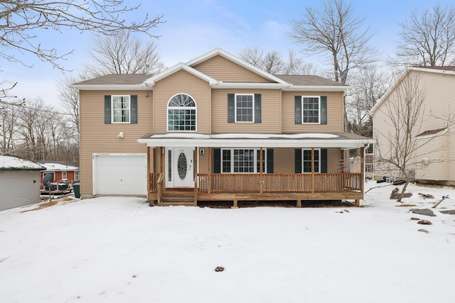 view of front of property with a garage and a porch