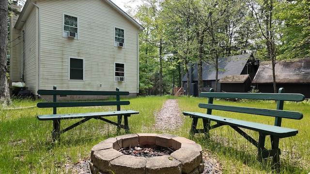 135 Tomhickon Trl, Pocono Lake, PA 18347 - view of home's community featuring a fire pit and a lawn