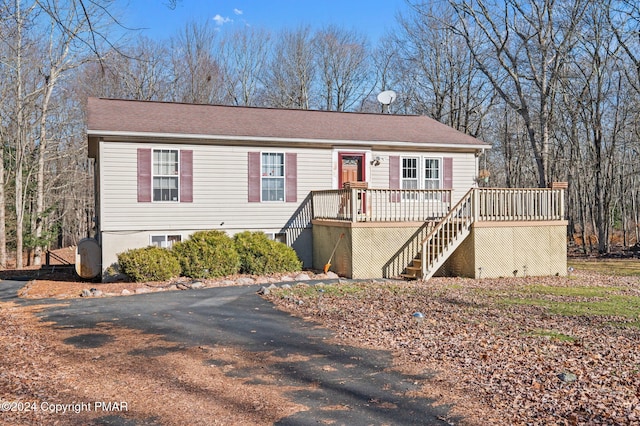 view of front of property featuring a deck and stairs