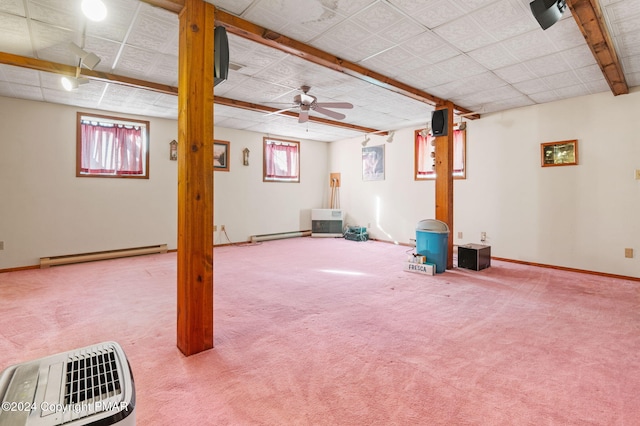 below grade area featuring carpet floors, baseboards, and baseboard heating