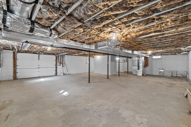unfinished basement featuring heating unit