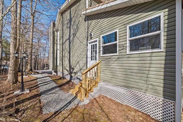 view of property exterior featuring entry steps