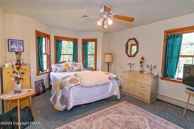 295 Hty Rd, Kunkletown, PA 18058 - carpeted bedroom featuring a baseboard radiator, multiple windows, and ceiling fan
