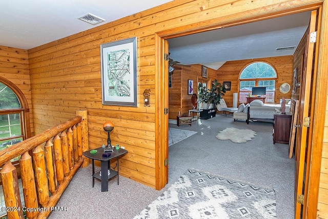 295 Hty Rd, Kunkletown, PA 18058 - hall with carpet floors, wood walls, an upstairs landing, and lofted ceiling