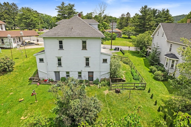 100 Mahoning Dr E, Lehighton, PA 18235 - back of property featuring a chimney, stairs, and roof with shingles