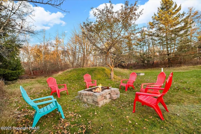 view of yard featuring an outdoor fire pit