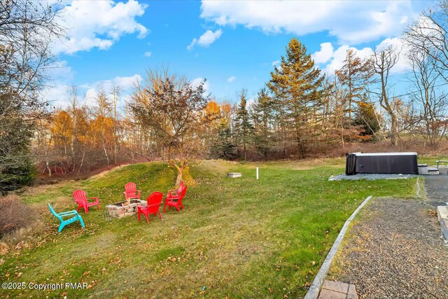 view of yard with a fire pit