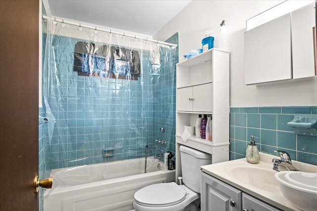 8062 Red Squirrel Dr, Tobyhanna, PA 18466 - bathroom featuring toilet, shower / bath combo with shower curtain, tile walls, and vanity