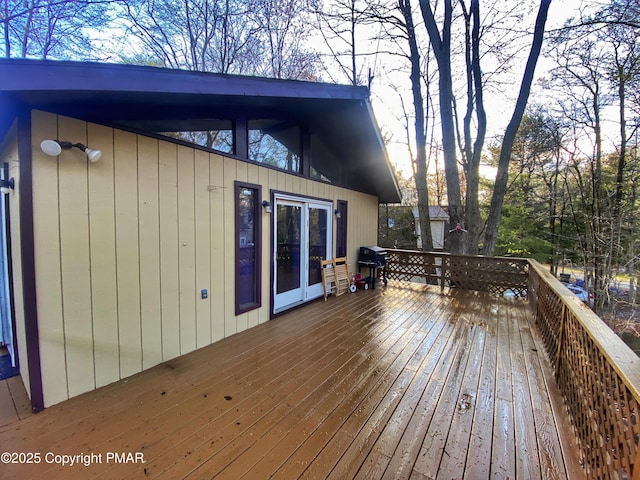 wooden terrace with area for grilling