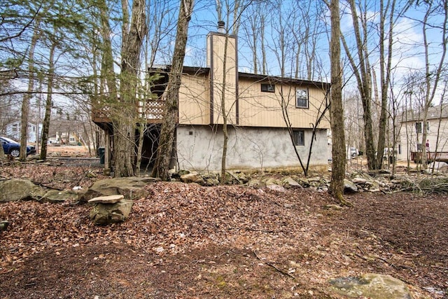 8062 Red Squirrel Dr, Tobyhanna, PA 18466 - view of side of property with a chimney