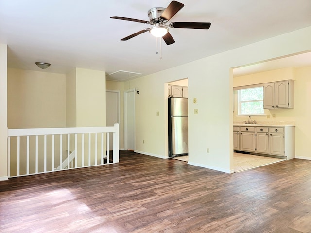 1169 Hunters Woods Dr, East Stroudsburg, PA 18301 - unfurnished room with a sink, attic access, wood finished floors, and a ceiling fan