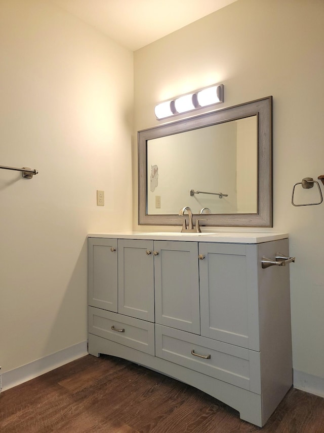 1169 Hunters Woods Dr, East Stroudsburg, PA 18301 - bathroom with vanity, wood finished floors, and baseboards