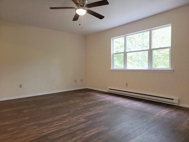 1169 Hunters Woods Dr, East Stroudsburg, PA 18301 - empty room featuring a baseboard heating unit, dark wood finished floors, baseboards, and ceiling fan
