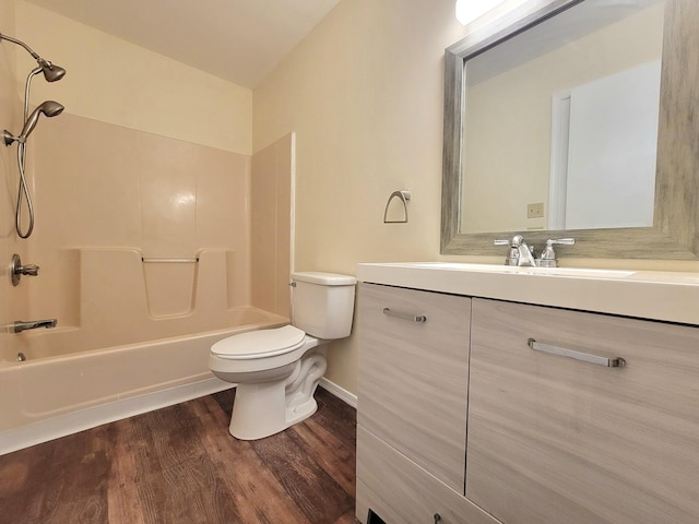 1169 Hunters Woods Dr, East Stroudsburg, PA 18301 - bathroom with washtub / shower combination, toilet, vanity, and wood finished floors