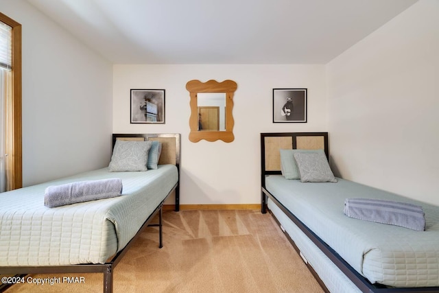 carpeted bedroom with baseboards