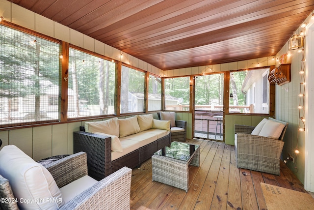 sunroom / solarium featuring wooden ceiling