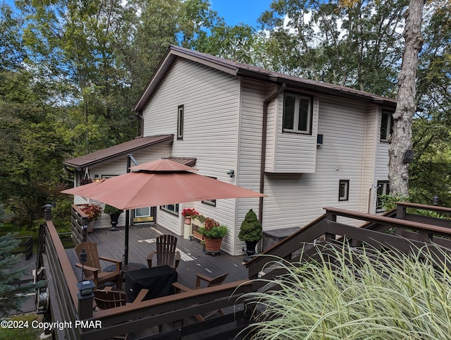 view of property exterior featuring a wooden deck