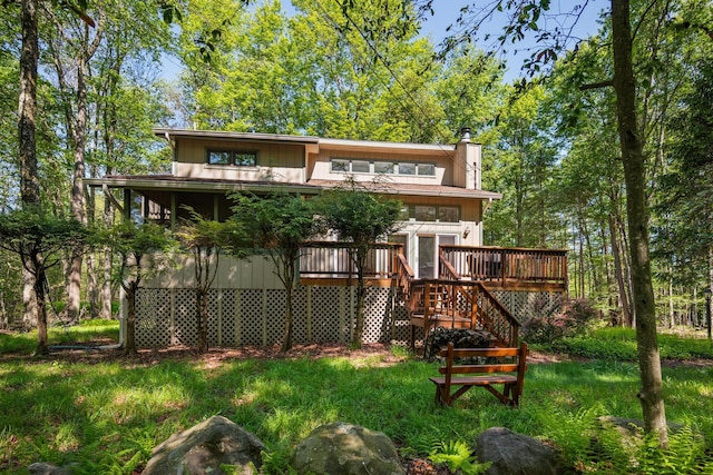 4169 Hemlock Trl, Pocono Pines, PA 18350 - back of property featuring stairs, a deck, and a chimney