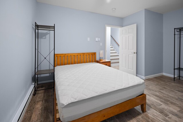 4169 Hemlock Trl, Pocono Pines, PA 18350 - bedroom with wood finished floors and baseboard heating