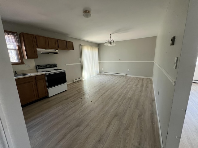 1227 Alder Rd, East Stroudsburg, PA 18302 - kitchen featuring electric stove, ventilation hood, brown cabinetry, and a baseboard radiator