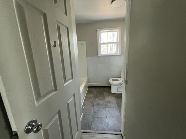 1227 Alder Rd, East Stroudsburg, PA 18302 - bathroom with a baseboard radiator, stone tile flooring, and toilet