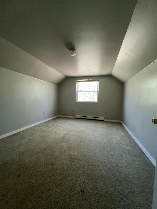 1227 Alder Rd, East Stroudsburg, PA 18302 - additional living space with vaulted ceiling, carpet floors, baseboard heating, and baseboards