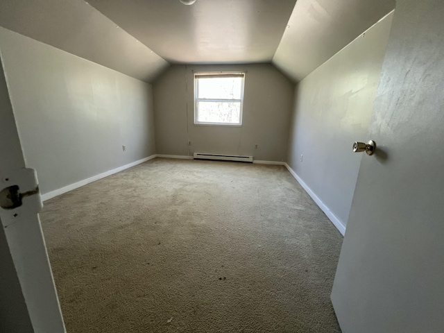 1227 Alder Rd, East Stroudsburg, PA 18302 - additional living space featuring vaulted ceiling, light colored carpet, baseboard heating, and baseboards