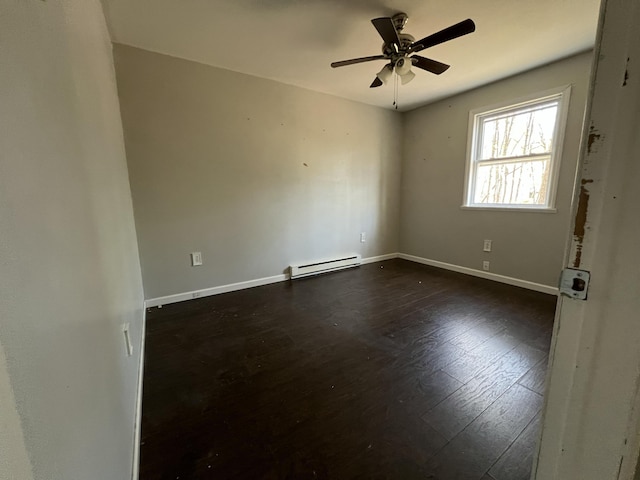 1227 Alder Rd, East Stroudsburg, PA 18302 - empty room with baseboards, ceiling fan, dark wood-style flooring, and a baseboard radiator