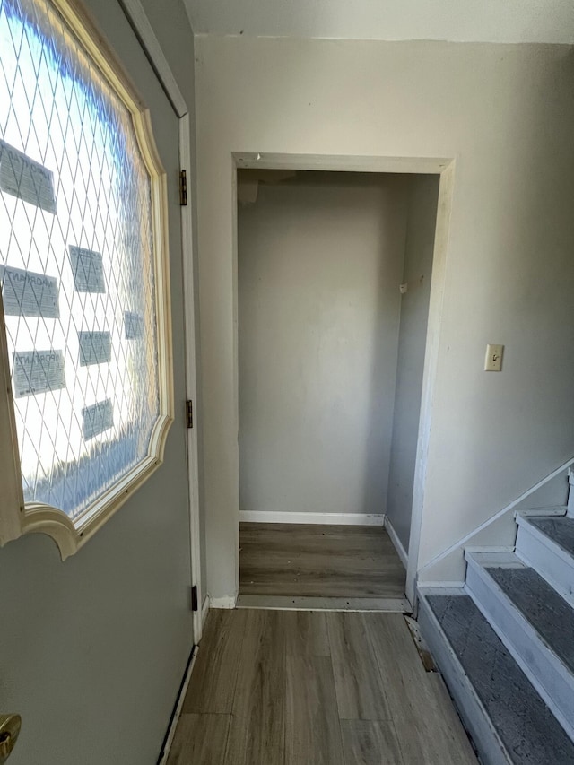 1227 Alder Rd, East Stroudsburg, PA 18302 - hallway featuring wood finished floors, plenty of natural light, stairs, and baseboards