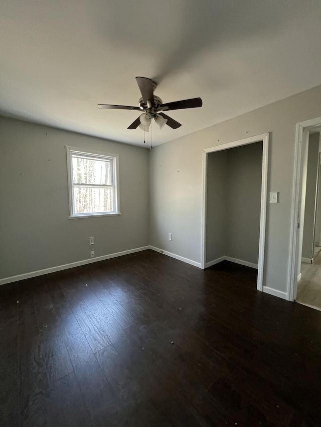 1227 Alder Rd, East Stroudsburg, PA 18302 - empty room with baseboards, a ceiling fan, and dark wood-type flooring