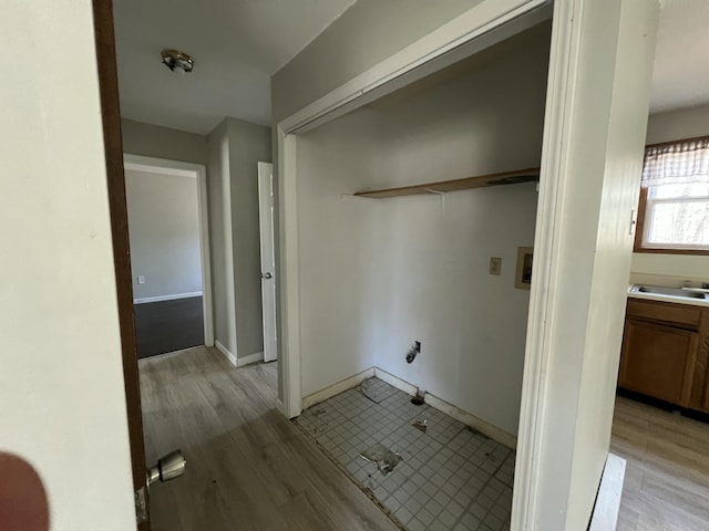 1227 Alder Rd, East Stroudsburg, PA 18302 - washroom with washer hookup, light wood-type flooring, baseboards, and a sink