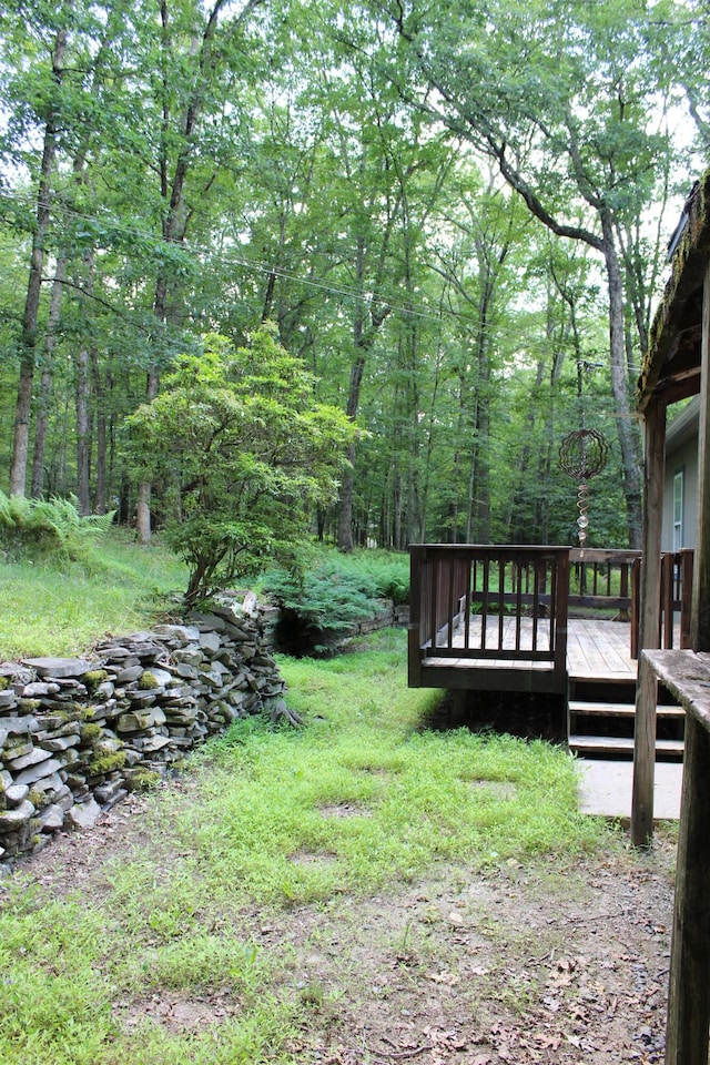 5147 Arrowhead Ln, East Stroudsburg, PA 18302 - view of yard featuring a wooden deck and a wooded view