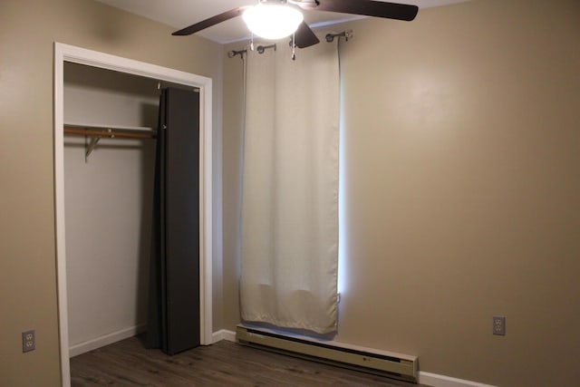 5147 Arrowhead Ln, East Stroudsburg, PA 18302 - unfurnished bedroom featuring baseboard heating, dark wood-style floors, ceiling fan, and a closet