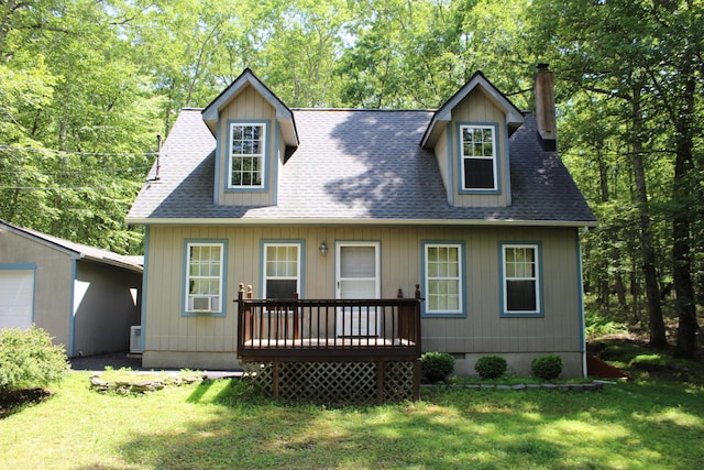 5147 Arrowhead Ln, East Stroudsburg, PA 18302 - view of front facade featuring a chimney, a deck, a front lawn, and roof with shingles
