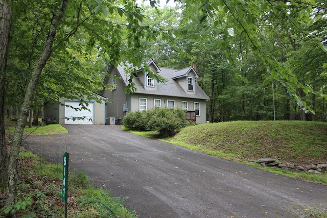 5147 Arrowhead Ln, East Stroudsburg, PA 18302 - cape cod house featuring a chimney, asphalt driveway, a garage, and a shingled roof