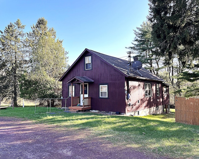247 Buck Blvd, White Haven, PA 18661 - view of front of home with a front lawn, roof with shingles, fence, and a chimney