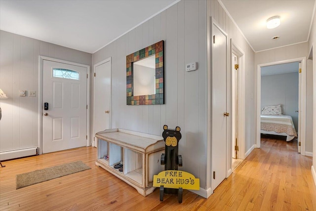 275 Selig Rd, Pocono Lake, PA 18347 - foyer entrance with light wood-style flooring, ornamental molding, and a baseboard heating unit