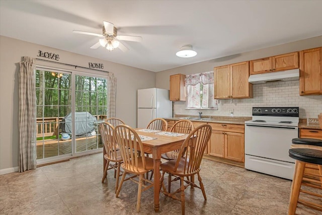 275 Selig Rd, Pocono Lake, PA 18347 - kitchen with white appliances, under cabinet range hood, backsplash, a ceiling fan, and light countertops