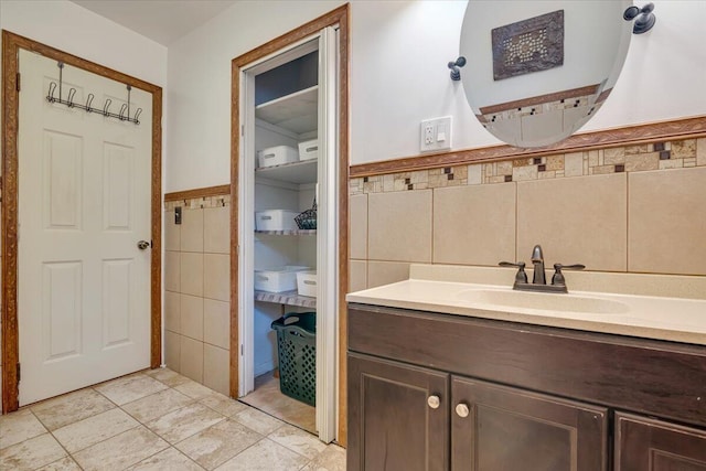 275 Selig Rd, Pocono Lake, PA 18347 - bathroom with tile walls, vanity, tile patterned flooring, and a wainscoted wall