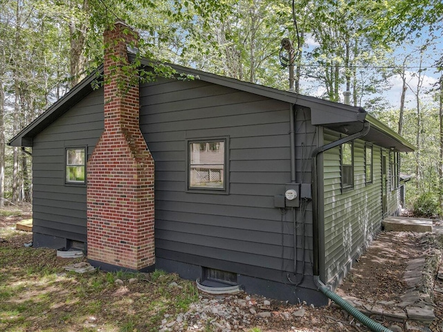 275 Selig Rd, Pocono Lake, PA 18347 - view of home's exterior with a chimney