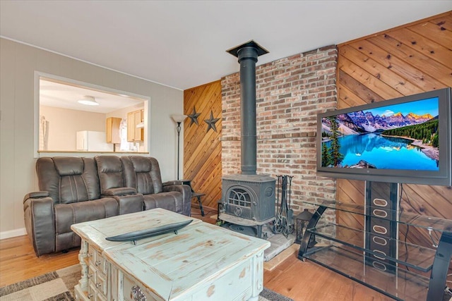 275 Selig Rd, Pocono Lake, PA 18347 - living area featuring a wood stove, wooden walls, and light wood-type flooring