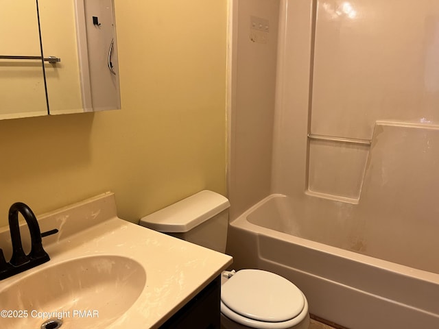 bathroom with toilet and vanity