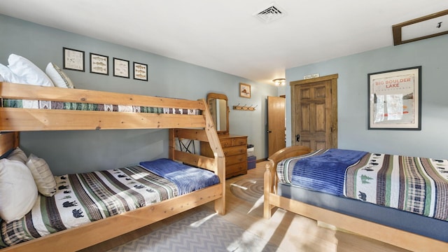 bedroom featuring visible vents