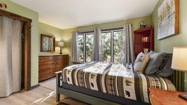 bedroom featuring light wood-style flooring