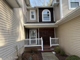 doorway to property with a porch