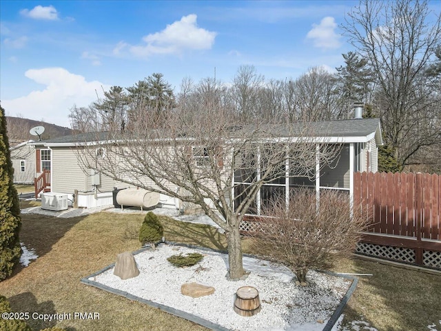 view of yard with entry steps and fence