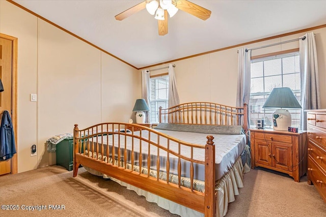 bedroom with lofted ceiling, multiple windows, crown molding, and light colored carpet